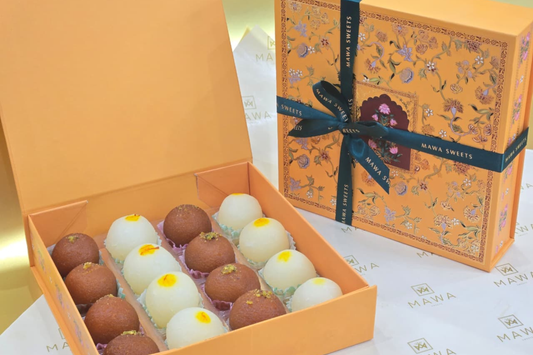 Golden Duo Box – Rasgulla & Gulab Jamun (16 Pieces)